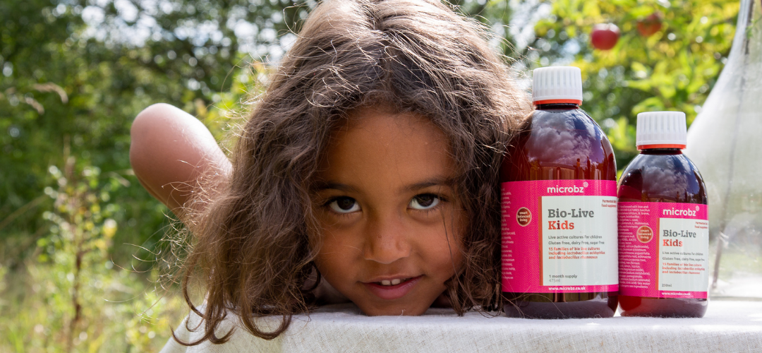 An image of a child with some kids probiotic