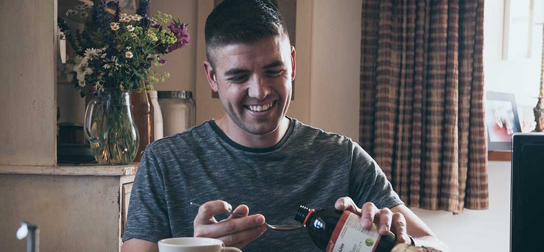 Happy healthy man taking Bio-Live for help their liver