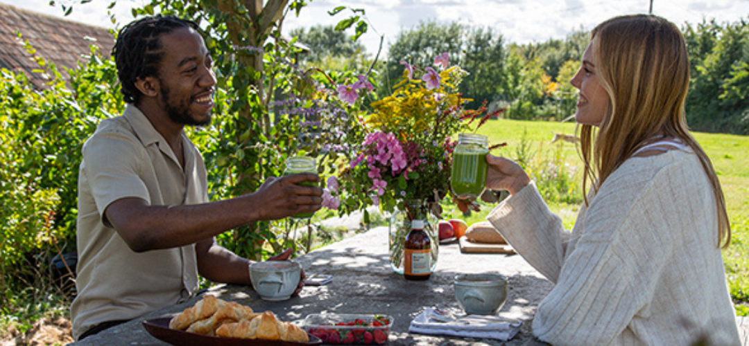 image of two people sitting outside on a summers day