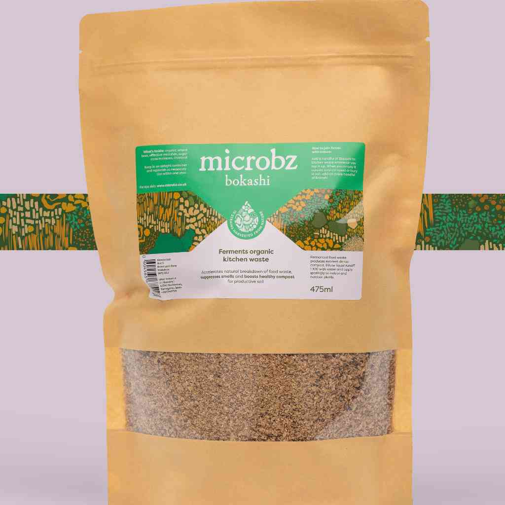 a packet of microbz bokashi, a wheat bran substrate with microbes to help compost kitchen waste, with graphic illustration
