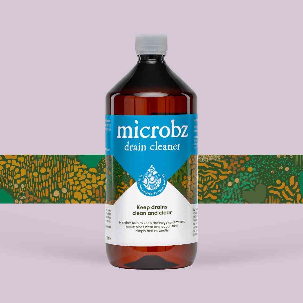 bottle of microbz living liquid probiotic for clean and clear drains, with graphic illustration