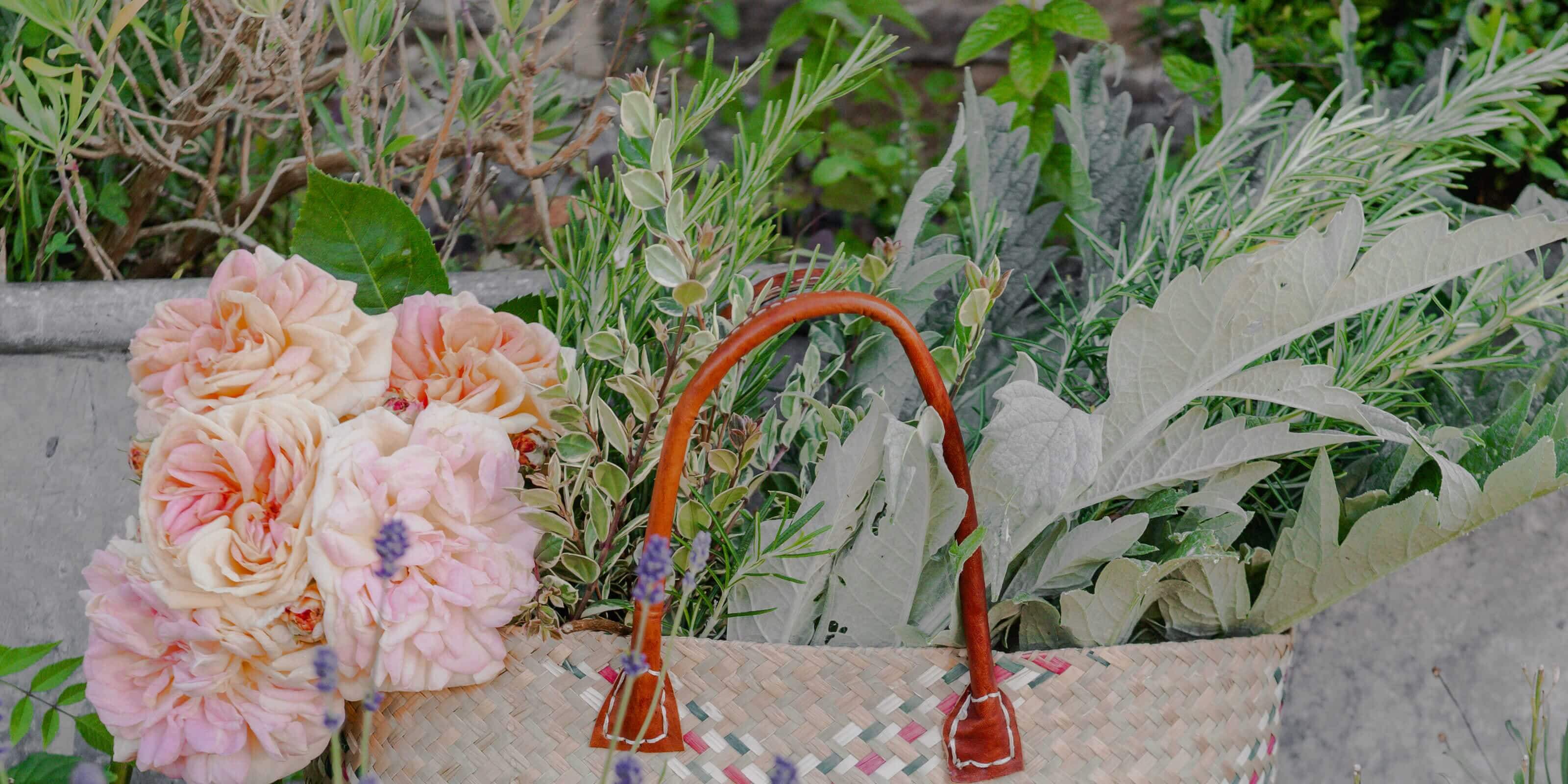 woven bag containing flowers and vegetables