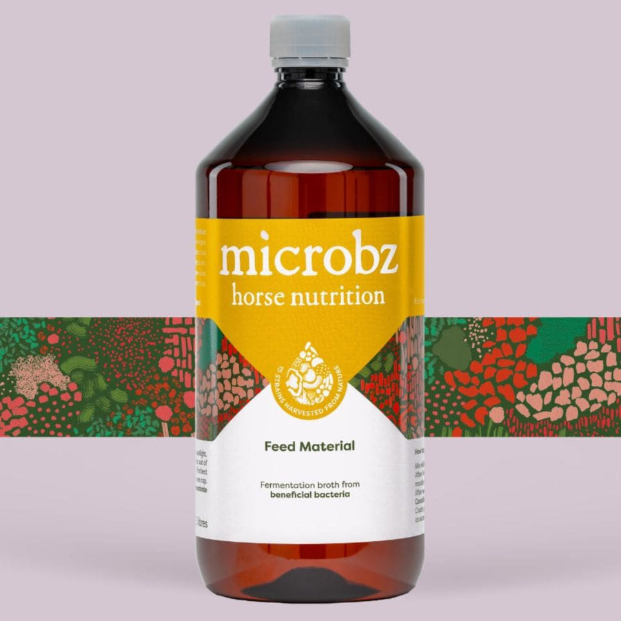 A bottle of Microbz horse nutrition probiotic supplement with a label that includes the brand name and the text 'Food Matrixial'. The background has a colorful pattern. this can be used for horse gut health