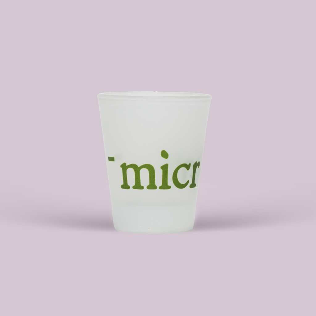 1 branded shot glass that says microbz and a fill line indicating 15ml