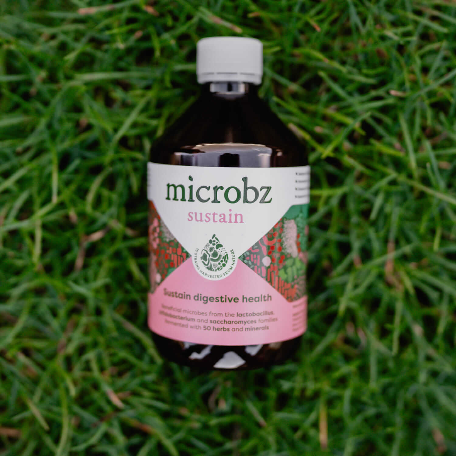 bottle of microbz sustain on grass