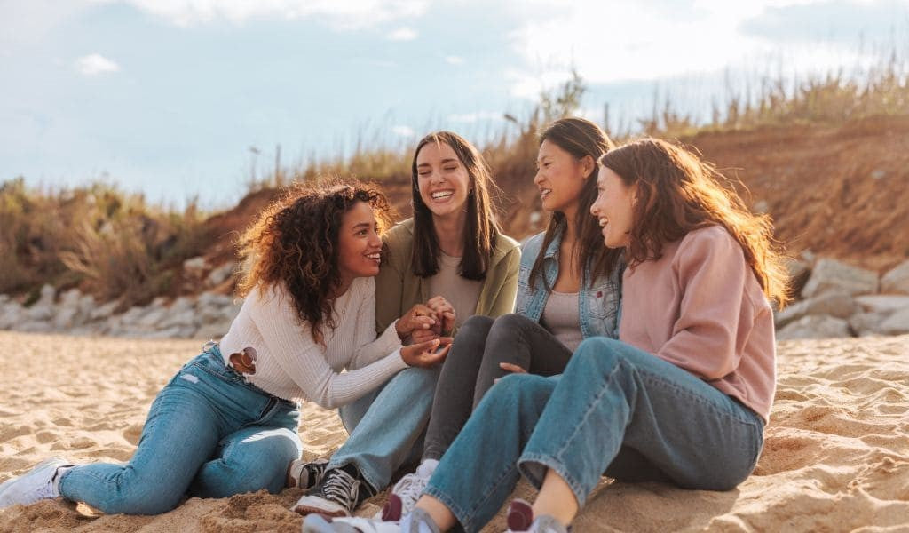 Happy and healthy woman smiling, symbolizing balance, well-being, and the power of probiotics in supporting women's health through life's challenges