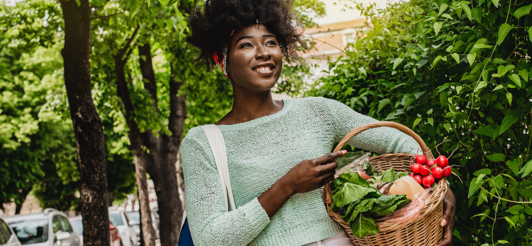 an image of a woman carrying a basket of vegetables