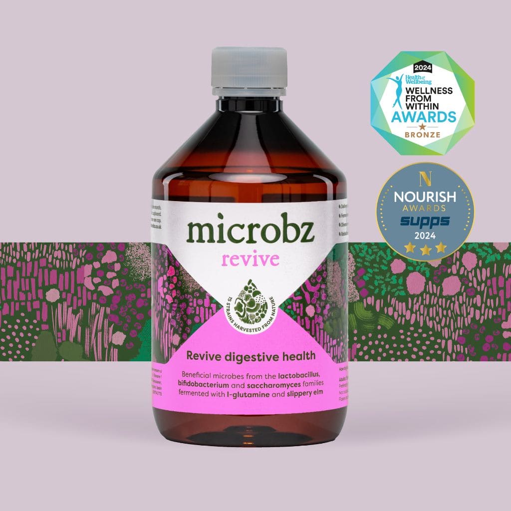 A picture of a bottle of microbz revive probiotic with two award logos