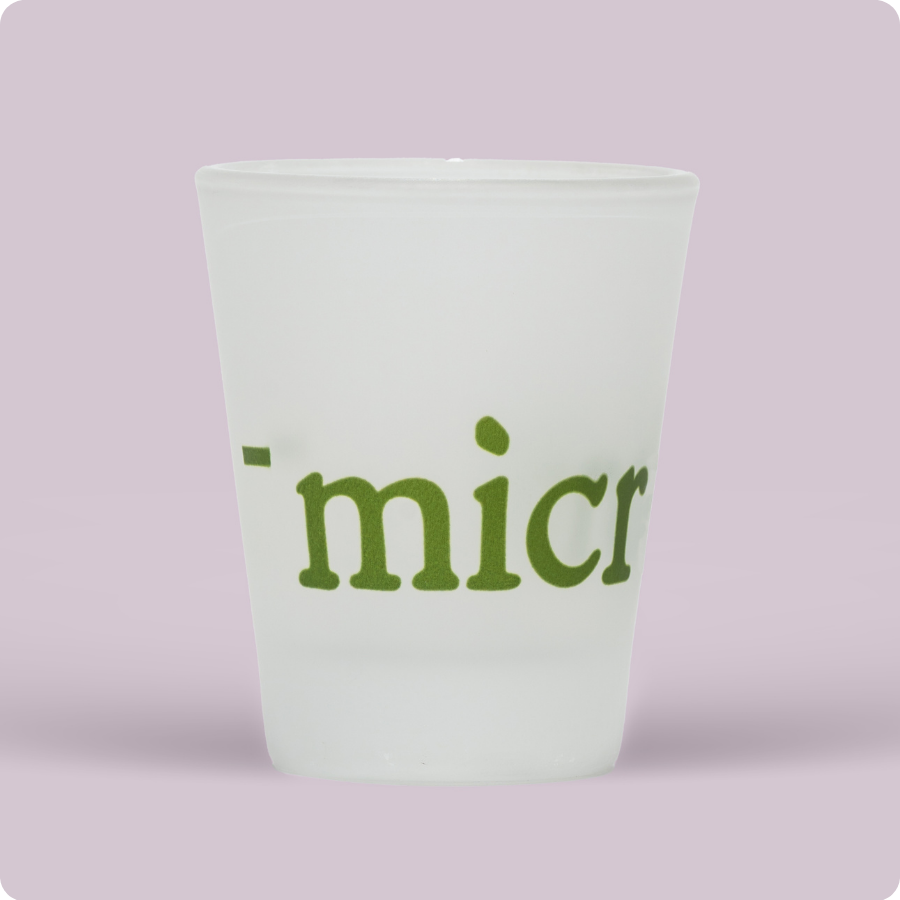 1 branded shot glass that says microbz and a fill line indicating 15ml