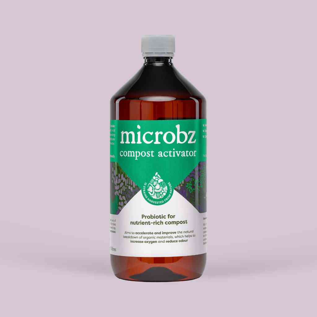 bottle of microbz compost activator living liquid probiotic for breaking down compost, with graphic illustration