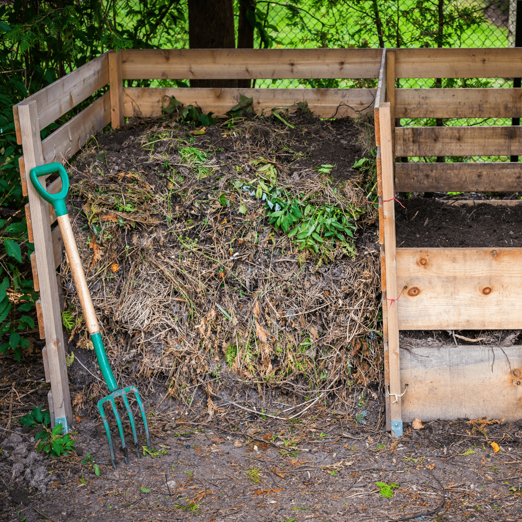 compost pile in a wooden structure